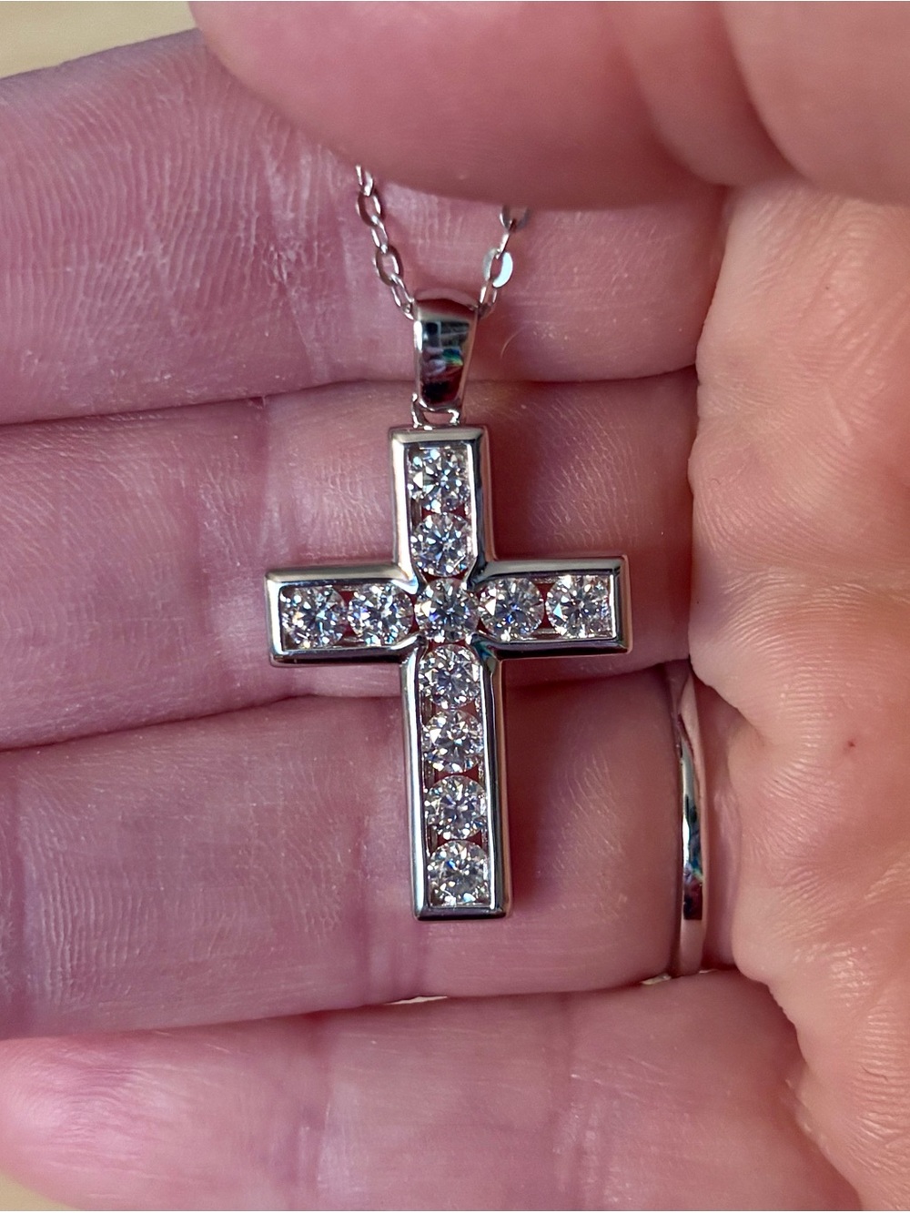 A beautiful 2.2ctw Moissanite cross. Classic, elegant, contemporary & trés chic!